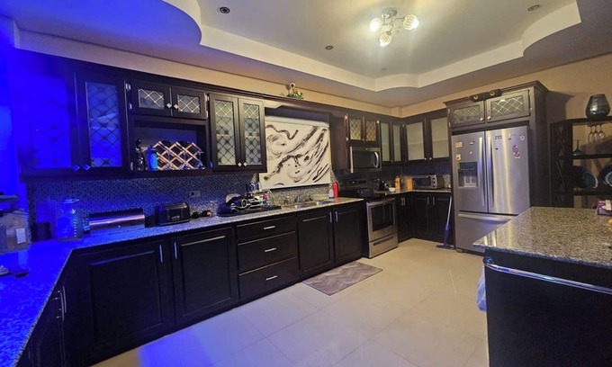 Claxton Bay House | This spacious property features a fully equipped kitchen, and an inviting small pool