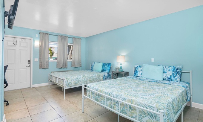 Palm Isles Resort | Tropical Two Queen Bed Room at Fort Myers Beach