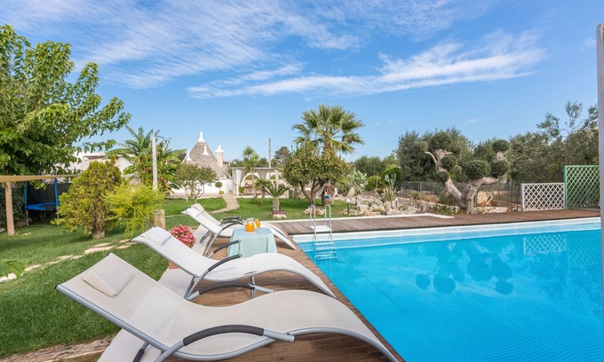 San Michele Salentino Villa | Trullo with private pool - garden games - outdoor kitchen - wood-burning oven