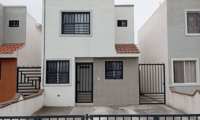 Apodaca House | Two-story house