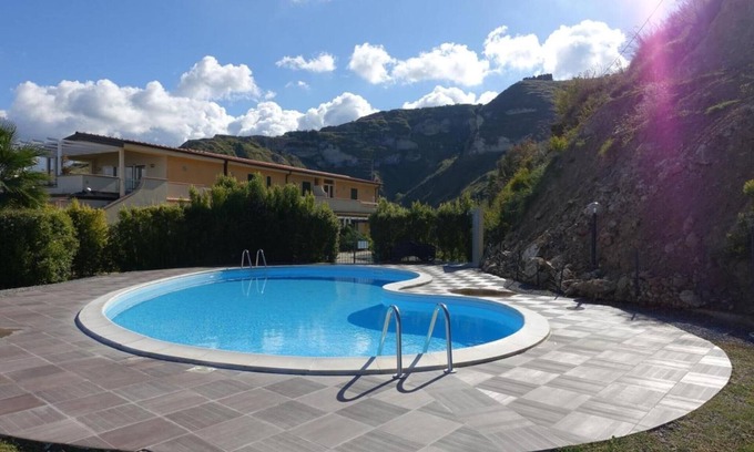 Parghelia House | Vacation Home "Terrazzo A9" with Sea View, Shared Pool & Wi-Fi