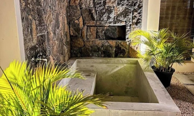 Cap Malheureux Cabin | Vanilla Lodge Private secluded external shower and bathtub.