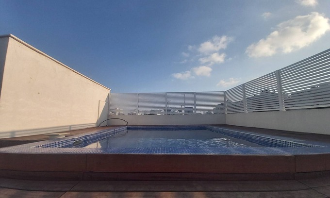 Netanya Cottage | Very beautiful penthouse with a hot swimming pool under blue skies .