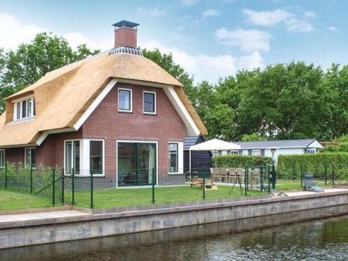 Idskenhuizen House | Villa in Friesland with Waterfront Garden