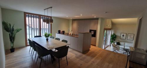 Bassersdorf Apartment | Visionary Hospitality Bassersdorf, Zürich - Premium Apartments in Swiss Style with Free Parking, Washer, Kitchen, Terrace, Vaulted Cellar Event Room, Bus Stop, 15' City & Airport