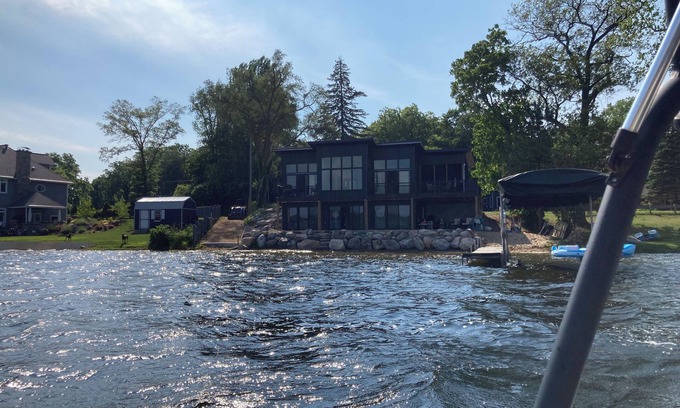 Delton House | Wall Lake Modern Home swimmable beach and paddle boat