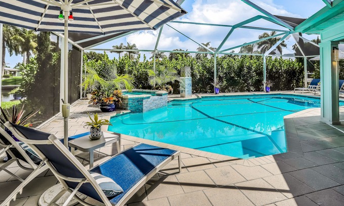 Yacht Club House | Waterfront escape in the heart of the action with pool, spa, grill, & WiFi