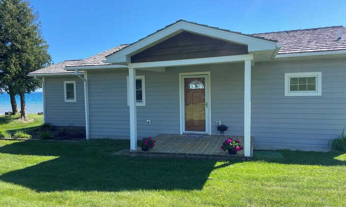 St Ignace House | Waterfront home on Lake Michigan with views of St Helena Island Lighthouse