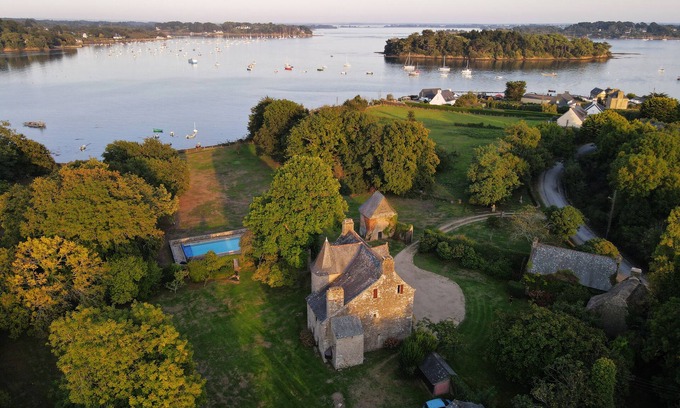 Baden House | Waterfront manor house with heated pool