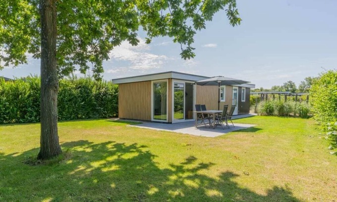 Burgh-Haamstede House | What immediately catches your eye upon entering is the garden-oriented living room with open kitchen