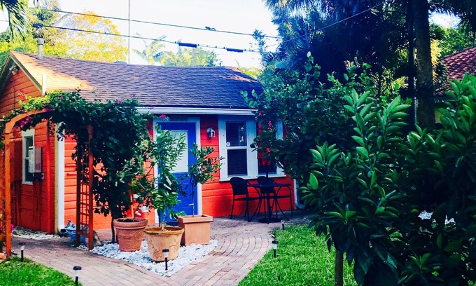 Parrot Cove Cottage | Whimsical Saffron & Rose Cottage Downtown. Walk to Restaurants, Beach& Galleries