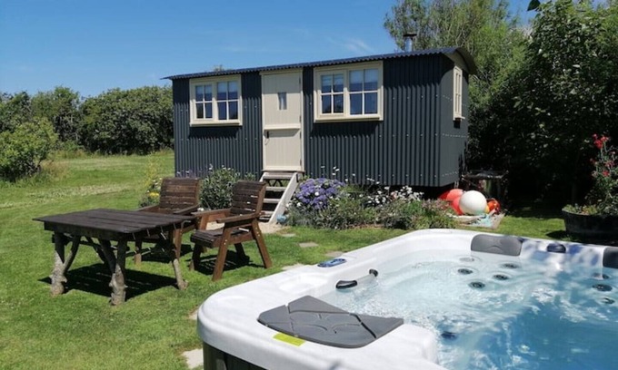 Bude House | Willow Tree Shepherd's Hut with optional hot tub and shared EV charger.