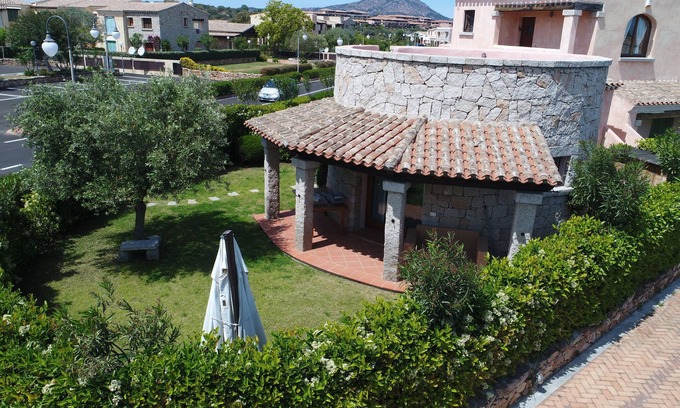 Porto San Paolo House | Wonderful head-end villa with large garden and solarium