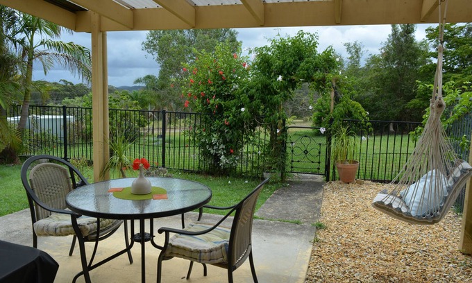 Bungwahl Cottage | Yarramin Park Farmstay - Pet Friendly, Couples Retreat. Fire pit.