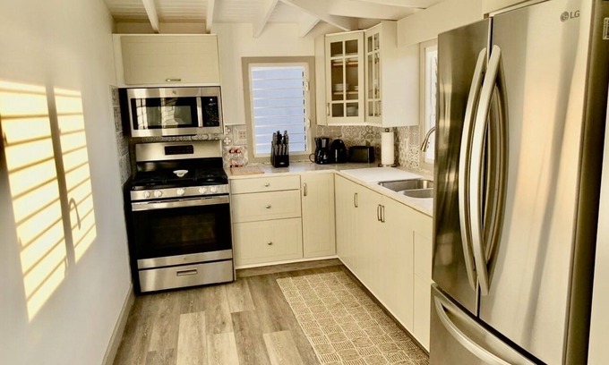 Dickenson Bay Bed & Breakfast | Yellow Maison - Romantic scenic villa 5 Mins from beach!