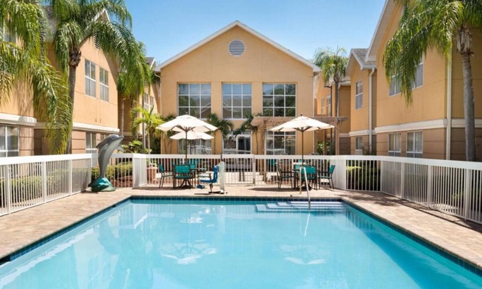 Feather Sound Hotel | Your Home Away From Home! Free Breakfast, Outdoor Pool, Full Kitchen!