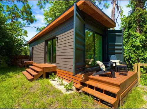 Estero House | Zen Container Tiny Home with Fenced-in Yard, Fire Pit, Centrally located and Pet Friendly