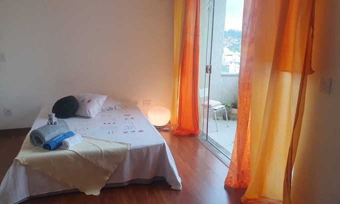 Buritis Apartment | Zen suit room, hot shower, balcony with a view and garage