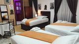 Habitación con 3 camas para 4 adultos