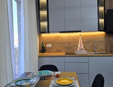 One-Bedroom Apartment with Balcony and Sea View