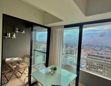 One-Bedroom Apartment with Balcony and City View