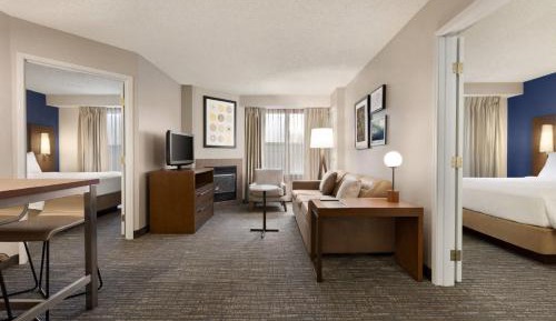 Two-Bedroom Suite with 3 Queen beds, 1 Sofa Bed, Full Kitchen, Living Space