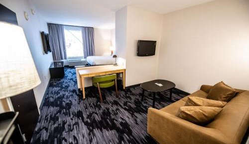 One-Bedroom Deluxe King Suite with Sofa Bed and Roll-In Shower - Mobility/Hearing Accessible