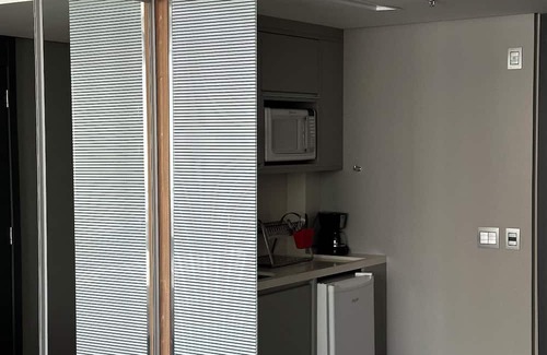 Agua Verde Apartment | Complete studio in Batel, Wi-Fi, kitchen and dining/work table