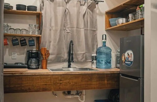 Bocas del Toro Cabin | Surfside tiny home with modern amenities like AC, modern design, bathtub,and TV.