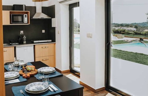 Peso Apartment | Spacious for 2 adults and 3 children, with mezzanine, star projector and baby kit (chair, crib, inflatable tub). Large window faces the pool, giving natural light, relaxing view and direct outdoor access—perfect for family comfort.