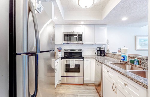 Surfcrest Village Condo | Recently updated resort condo with 2 pools, 2 balconies, ocean views, BBQ, & W/D