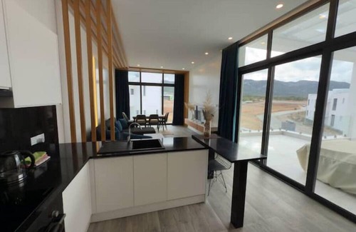 Bahceli Apartment | Modern penthouse in green resort: pool + gym