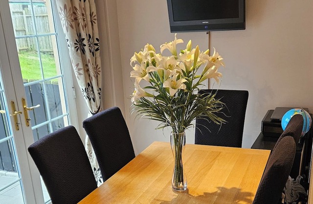 Semi detached home with garage. 3 bedrooms, 3 bathrooms. Treadmill in garage.