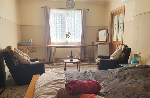 Renovated old farmhouse on 1 acre, in the centre of town, with creek and views!