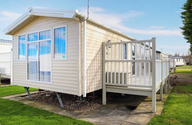 Comfortable modern 12ft-wide caravan with one double and two twin.